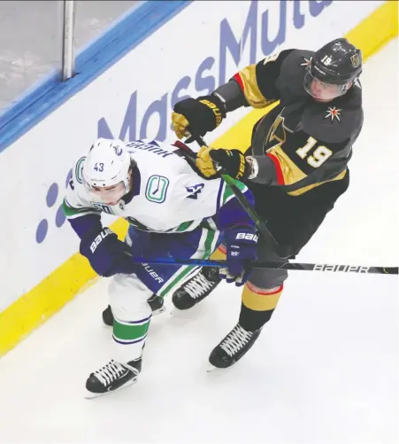  ?? GERRY THOMAS/USA TODAY SPORTS ?? Canucks defenceman Quinn Hughes is pressured as he passes the puck behind Vegas Golden Knights right winger Reilly Smith during Game 1 of their second-round NHL playoff series on Sunday at Rogers Place in Edmonton. Hughes was minus-3 in the 5-0 loss.