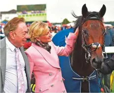  ?? Rex Features ?? Lord and Lady Lloyd-Webber with Too Darn Hot after it won the Champagne Stakes at Doncaster Racecourse.