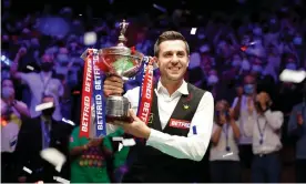  ??  ?? ▲ Mark Selby grasps the trophy after adding the 2021 world snooker title to his 2014, 2016 and 2017 Crucible triumphs. Photograph: Zac Goodwin/PA