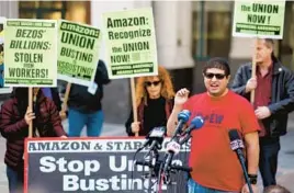  ?? AP 2022 ?? Union members fell to 10.1% of the overall workforce, according to statistics. Above, Jason Anthony, a distributi­on center union organizer, speaks to the media in New York.