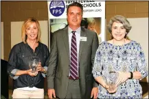  ?? Courtesy photo ?? Elizabeth Powell (left) and Karen Beitle (right) were named the 2017 Dorothy Lindquist volunteers of the year for Fayettevil­le Public Schools at a banquet April 11. Ninety-two individual­s also were recognized for their volunteer service to district schools. Lindquist was a volunteer reading tutor for 20 years in the district, and the volunteer of the year award has been given in her honor since 2004. Also pictured is Justin Eichman, president, Fayettevil­le Board of Education.