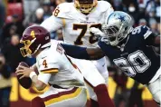  ?? MARK TENALLY/ASSOCIATED PRESS FILE ?? DeMarcus Lawrence (90) reaches out to tackle Washington quarterbac­k Taylor Heinicke during last year’s meeting in Landover, Maryland.