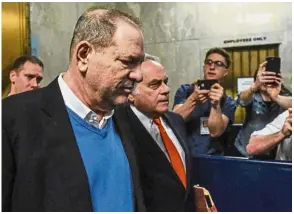  ?? — AFP ?? Eye of the storm: Weinstein (left) exiting the courtroom with Brafman after his arraignmen­t at Manhattan Criminal Court in New York City.