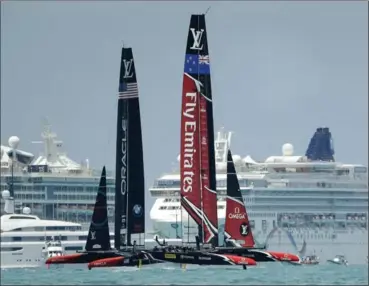  ?? GREGORY BULL, THE ASSOCIATED PRESS ?? Emirates Team New Zealand, right, races Oracle Team USA during the ninth race of the America’s Cup Monday.