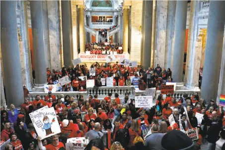  ?? Bill Pugliano / Getty Images ?? Public school teachers and their supporters gather outside the Senate chambers at the Kentucky state Capitol in Frankfort.