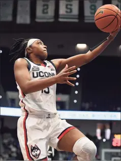  ?? Jessica Hill / Associated Press ?? UConn’s Christyn Williams goes up for a basket against Georgetown on Feb. 20.