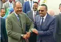  ?? AP ?? ethiopia’s Prime Minister Abiy Ahmed is welcomed by eritrea’s President Isaias Afwerki as he disembarks the plane, in Asmara, eritrea, on Sunday. —