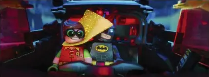  ?? COURTESY OF WARNER BROS. PICTURE ?? Robin, voiced by Michael Cera, left, and Batman, voiced by Will Arnett, in a scene from "The LEGO Batman Movie."