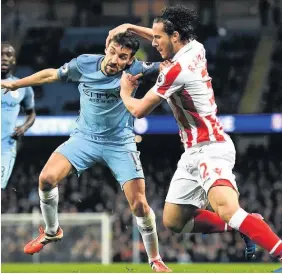  ??  ?? Ramadan Sobhi gets to grips with Manchester City’s Jesus Navas.