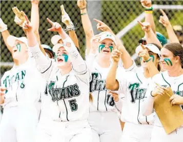  ?? MEG MCLAUGHLIN U-T ?? Poway’s Hailey Milgazo (5) and teammates celebrate one of two Sophia Burmeister home runs vs. Carlsbad.