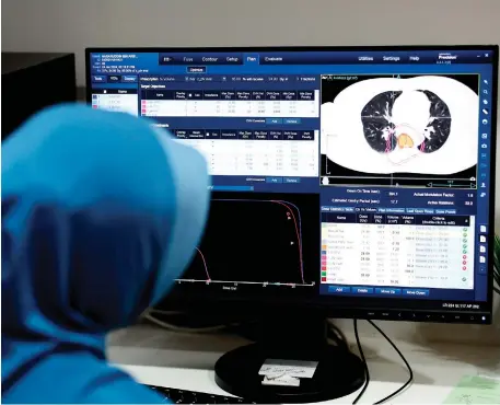  ?? — Bernama photos ?? A specialist shows the cancer cells’ imaging displayed on the scan monitor during the Bernama’s interview session at HKL’s Radiothera­py and Oncology Department.