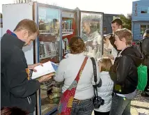  ??  ?? Christchur­ch people flocked to the ‘‘book fridge’’ when it opened in October 2011, an innovative project by the Gap Filler arts initiative after the earthquake­s.