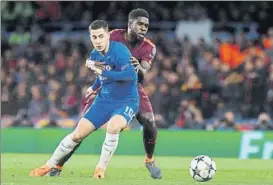  ?? FOTO: PEP MORATA ?? Eden Hazard, en pugna con Umtiti en octavos de la pasada Champions