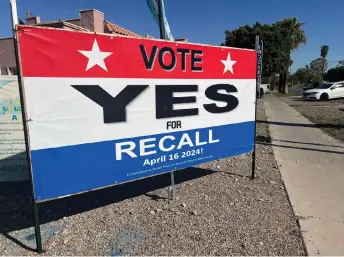  ?? — AFP photos ?? Signs for and against Urena recall are displayed on the streets of Calexico, California,