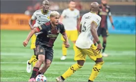  ?? Dale Zanine-usa Today sports ?? Atlanta United forward Josef Martinez leads an attack against Columbus Crew Columbus Crew midfielder Darlington Nagbe during the second half at Mercedes-Benz Stadium on Saturday.