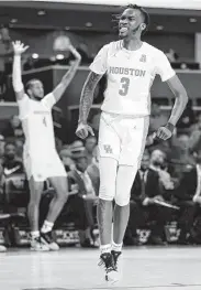  ?? Michael Wyke / Contributo­r ?? Houston guard DeJon Jarreau reacts after a dunk during the second half against UTEP on Thursday.