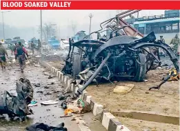  ??  ?? The mangled remains of the bus the CRPF jawans were travelling in when their convoy was attacked in Goripora area of Awantipora town in Pulwama district on Thursday.