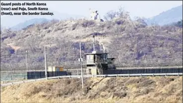  ?? ?? Guard posts of North Korea (rear) and Paju, South Korea (front), near the border Sunday.