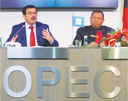  ??  ?? OPEC President Qatar’s Energy Minister Mohammed bin Saleh al-Sada and OPEC Secretary General Mohammad Barkindo address a news conference after a meeting of the Organizati­on of the Petroleum Exporting Countries (OPEC) in Vienna, Austria, Nov. 30.