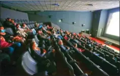  ?? (LaPresse/Cecilia Fabian) ?? People wear face masks and are distantly seated as they wait to watch a movie at the Quattro Fontane cinema in Rome.