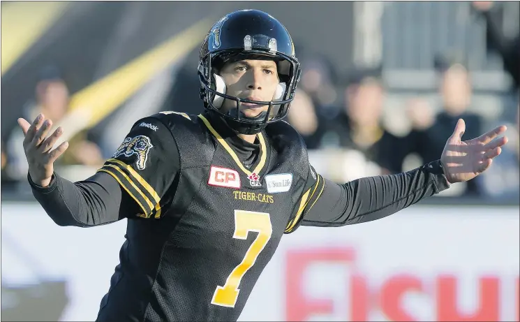  ?? — THE CANADIAN PRESS ?? Hamilton Tiger-Cats kicker Justin Medlock celebrates his game-winning field goal against the Toronto Argonauts in the CFL Eastern Division semifinal Sunday.