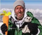  ??  ?? Family first: Ben with his kids’ cuddly toys on Everest’s peak