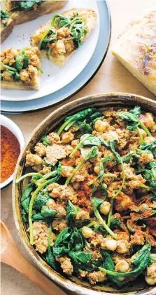  ?? PHOTOS: JOSH NEUBAUER ?? Serve this Spanish-inspired dish of spiced chickpeas and spinach on toasted sourdough bread, tapas-style.