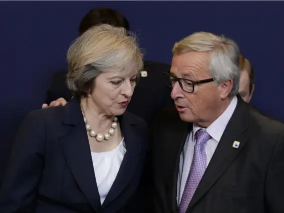  ??  ?? The PM with Jean-Claude Juncker at the European Council summit meeting in Brussels (Rex)