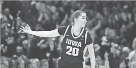  ?? ?? Iowa's Kate Martin reacts after a 3-point basket against South Carolina in the NCAA championsh­ip game April 7 in Cleveland. Martin has earned a spot on the Las Vegas Aces opening-day roster.