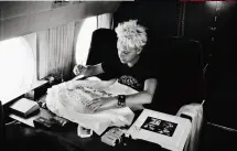  ??  ?? FLYING HIGH
Gore autographs a
T-shirt on a flight to the Rose Bowl in Pasadena, California, where director D.A. Pennebaker shot their 1989 concert movie, 101. Corbijn had permission to shoot whatever he wanted while the band traveled. “I’m not a studio guy,” he says. “I’m about getting moments.”