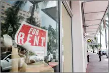  ??  ?? In this file photo, a For Rent sign hangs on a closed shop during the coronaviru­s pandemic in Miami Beach, Fla. Nearly half of Americans whose families experience­d layoffs during the pandemic now believe their lost jobs will not return, a new poll from The Associated Press-NORC Center for Public Affairs Research shows, as temporary layoffs give way to shuttered businesses, bankruptci­es and lasting payroll cuts. (AP)