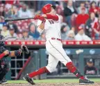  ?? JOHN MINCHILLO/THE CANADIAN PRESS ?? Canadian pro baseball players, such as Cincinnati Reds slugger Joey Votto, are more likely to be left-handed batters, according to new research.