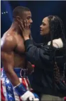  ??  ?? Michael B. Jordan’s Adonis Creed and Tessa Thompson’s Bianca face a couple of life’s challenges in “Creed II.”