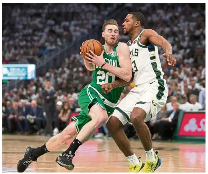  ??  ?? Out of my way: Boston Celtics forward Gordon Hayward (left) vying for the ball with Milwaukee Bucks guard Sterling Brown during Game 2 of the NBA Playoffs second round at the Fiserv Forum on Tuesday. — Reuters