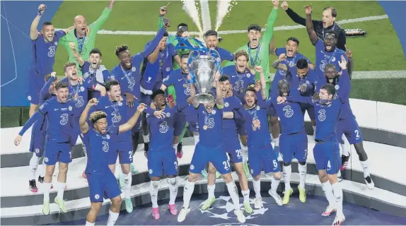  ??  ?? Chelsea's Cesar Azpilicuet­a (centre) and team-mates celebrate with the trophy after the UEFA Champions League final victory over Manchester City.