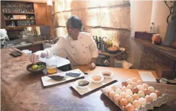  ?? DAVID WALLACE/THE REPUBLIC ?? Chef Nobuo Fukuda grates yuzu zest to top his cold chawanmush­i at Nobuo At Teeter House in Phoenix.