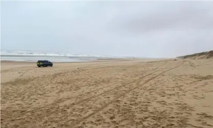  ??  ?? A police car is seen on the Plage du Gressier in Le Porge. Photograph: Camille Cassou/AFP via Getty Images