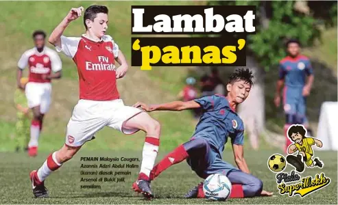  ??  ?? PEMAIN Malaysia Cougars, Azannis Adzri Abdul Halim (kanan) diasak pemain Arsenal di Bukit Jalil, semalam.