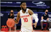  ?? DAVID JABLONSKI / STAFF ?? Jalen Crutcher finished his Dayton career last March as the 16thranked scorer in school history (1,593 points).