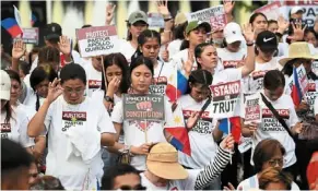  ?? ?? Show of support: supporters of Quiboloy holding a prayer rally at a park in Manila. — afp