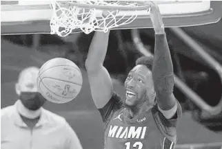  ?? SUE OGROCK/AP ?? Heat center Bam Adebayo (13) dunks Monday night against the Thunder.