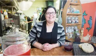  ?? FRANK GUNN/THE CANADIAN PRESS ?? The menu at Tea-N-Bannock reflects traditiona­l dishes of different tribes and features baked or fried bannock. Most of the staff is from different First Nations groups — Cree, Ojibwa and Mohawk — and they collaborat­e on menu items. Tina Ottereyes, who...