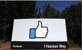  ?? ASSOCIATED PRESS ?? THIS 2018 FILE PHOTO SHOWS a Facebook logo at the company’s headquarte­rs in Menlo Park, Calif. Facebook’s ambitious plan to create a new financial system based on a digital currency faces questions from lawmakers, as it’s shadowed by negative comments from President Donald Trump, his Treasury secretary and the head of the Federal Reserve.