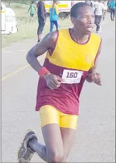  ?? ?? Sikhumbuzo Sihlongony­ane as he gets closer to the finish line.