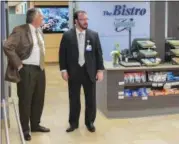  ?? ERIC BONZAR — THE MORNING JOURNAL ?? WOBL/WDLW General Manager Doug Wilber, left, and Mercy Foundation of Lorain County President Scott Pember check out the newly renovated CommStar Bistro, at Mercy Health, in Lorain, Nov. 14.