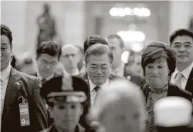  ?? Andrew Harnik / Associated Press ?? South Korean President Moon Jae-in, center, arrives to meet with Senate leadership on Capitol Hill, his first overseas trip since taking office last month.