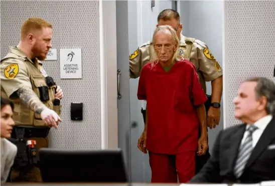  ?? CHARLES REX ARBOGAST/ASSOCIATED PRESS ?? Joseph Czuba, 71, is led Monday into a Will County, Ill., courtroom for his arraignmen­t in the murder of a 6-year-old boy.