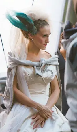  ?? DARLA KHAZEI/AP 2007 ?? Sarah Jessica Parker’s“Sex and The City”character, Carrie Bradshaw, is just one of the former brides restyling their wedding dresses to wear again.