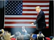  ?? JOE RAEDLE / GETTY IMAGES ?? U.S. President Donald Trump held a rally at the Pensacola Bay Center on Friday in Pensacola, Florida. Trump gave a further endorsemen­t of Alabama Republican Senatorial candidate Roy Moore.