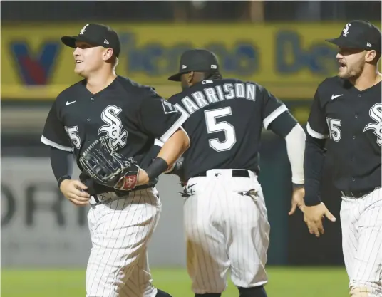  ?? JOHN J. KIM/CHICAGO TRIBUNE ?? Andrew Vaughn, left, celebrates with teammates after a win over the Tigers on Aug. 12. The former first-round pick is the likely candidate to replace José Abreu at first base if Abreu leaves via free agency.